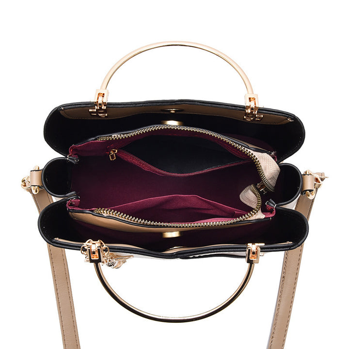 Colour block handbag with heart tassel