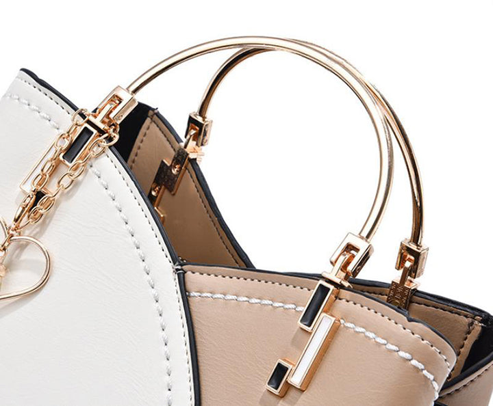Colour block handbag with heart tassel